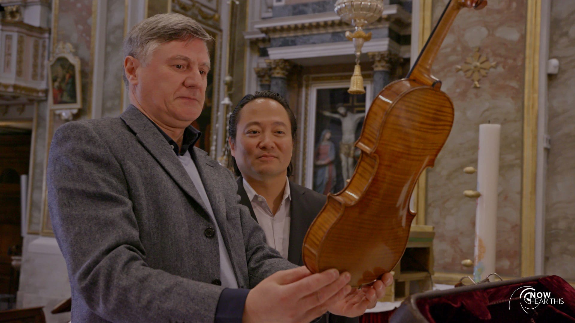 Scott looking at a Stradivarius