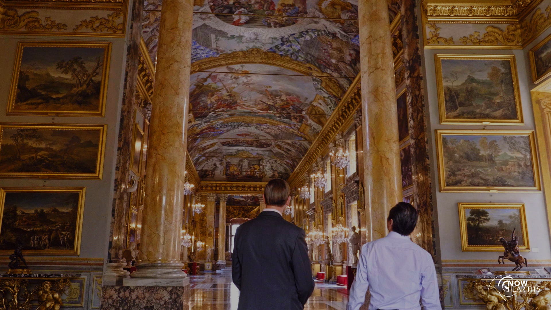 Scott looking at a Baroque interior with paintings